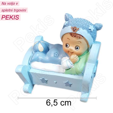 Figurica DEČEK v zibelki